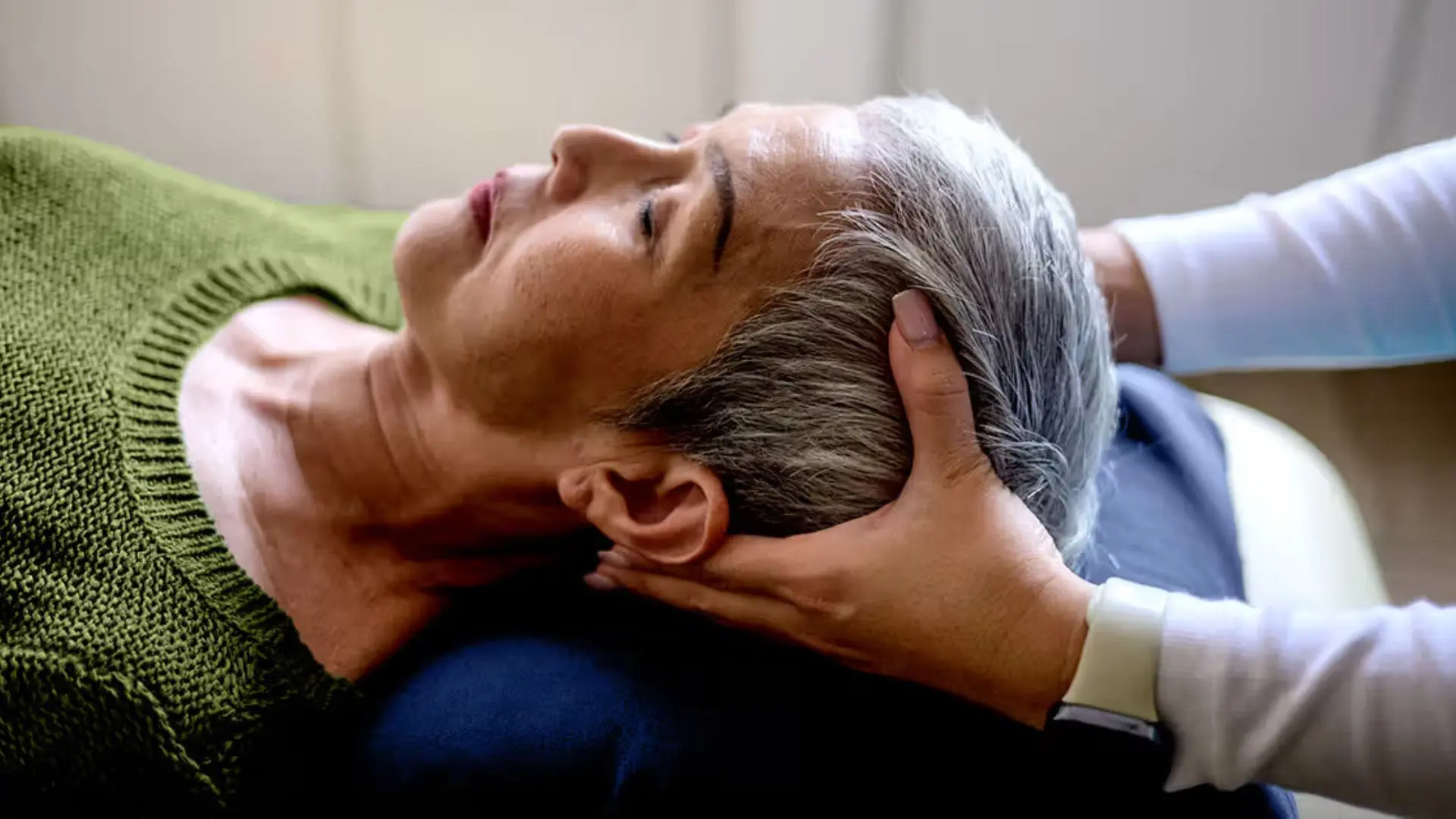 68309925e96d6_craniosacral A person receiving a gentle head massage.