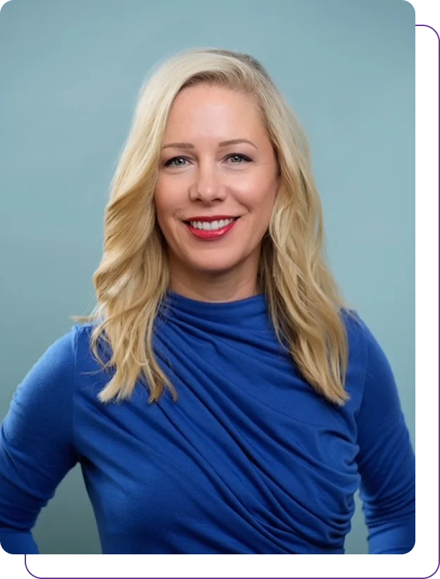 Group 1321317534 A smiling woman with blonde hair wearing a blue top.